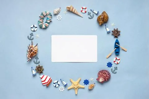 Round frame made of decorative items and miniature toys: seashells, seastars, Stock Photos