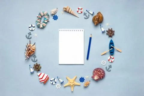 Round frame made of decorative items and miniature toys: seashells, seastars, Stock Photos