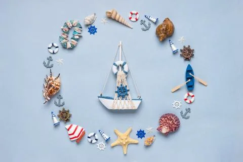 Round frame made of decorative items and miniature toys: seashells, seastars, Stock Photos