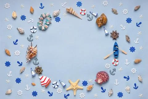 Round frame made of decorative items and miniature toys: seashells, seastars, Stock Photos