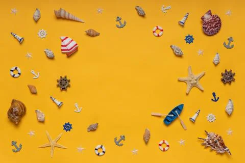 Round frame made of decorative items and miniature toys: seashells, seastars, Stock Photos