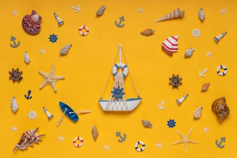 Round frame made of decorative items and miniature toys: seashells, seastars, Stock Photos