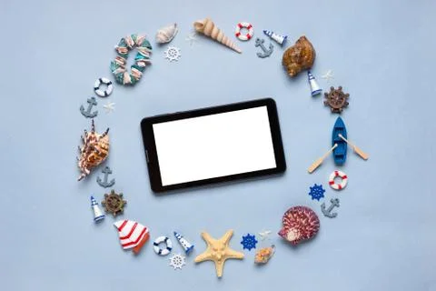 Round frame made of decorative items and miniature toys: seashells, seastars, Stock Photos