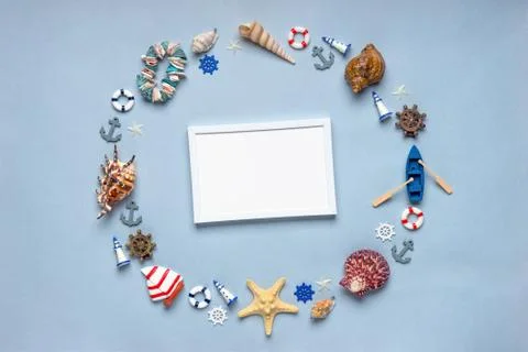 Round frame made of decorative items and miniature toys: seashells, seastars, Stock Photos