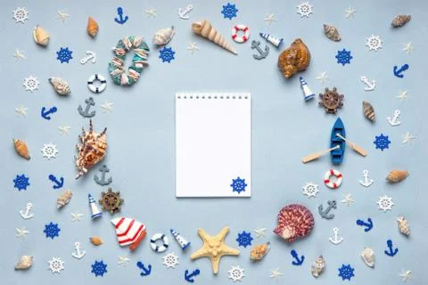Round frame made of decorative items and miniature toys: seashells, seastars, Stock Photos
