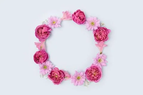 Round frame made of pink rose, aster and alstroemeria. Stock Photos