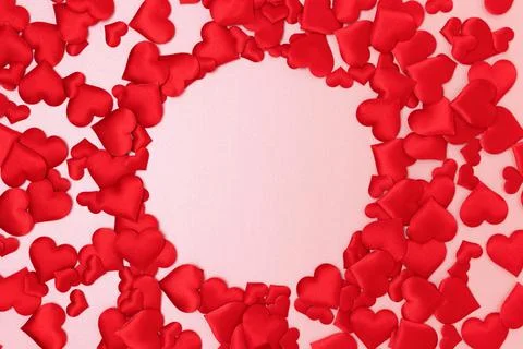 Round frame made of textile red confetti in a heart shape. Stock Photos