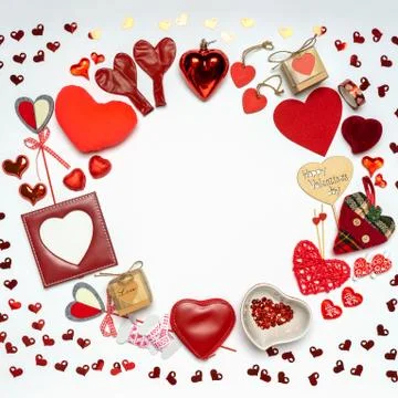 Round frame made of various decorative red hearts and romantic items: gifts,  Stock Photos
