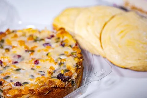 A round fruit and nut cake with cranberries, apricots and seeds. Stock-Fotos
