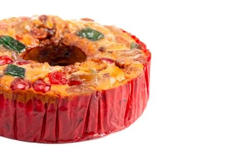 Round Fruit Cake with Cherries Pineapples and Nuts on a White Background Stock Photos