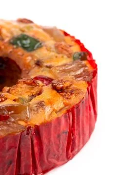 Round Fruit Cake with Cherries Pineapples and Nuts on a White Background Stock Photos