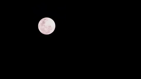 Round full moon in night sky blotted out as clouds move before it 스톡 동영상 319523803
