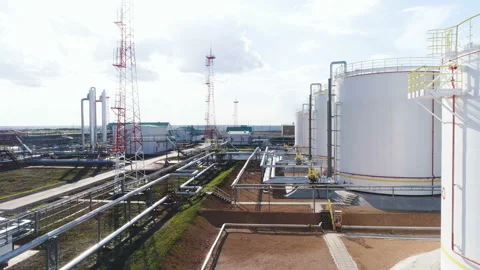 Round Gas Tanks with Connected Pipelines Aerial View Stock Footage