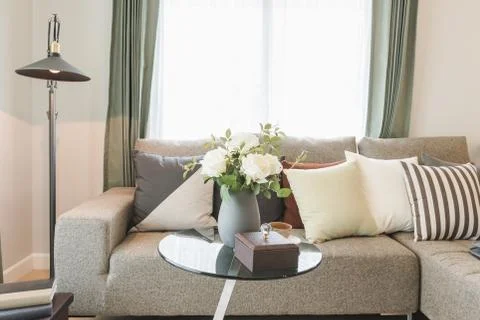 Round glass table with set of sofa in modern living room Stock Photos