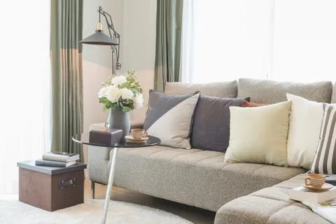 Round glass table with set of sofa in modern living room Stock Photos