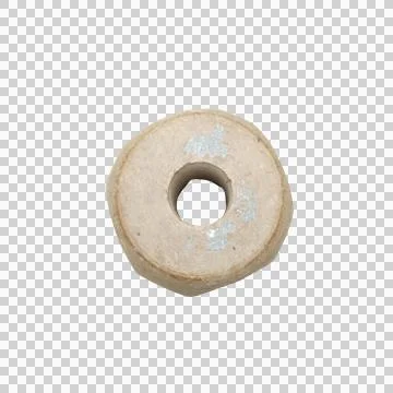 Round grey stone wheel with central circular hole donut weight isolated Фото