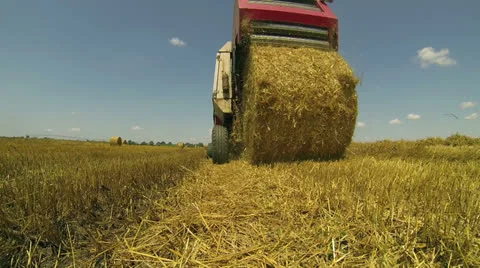 Round Hay Baler Making A Bale Stock Footage 25702899