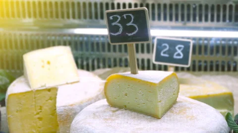 Round head brie cheese on the counter of the store Stock Footage 68299569