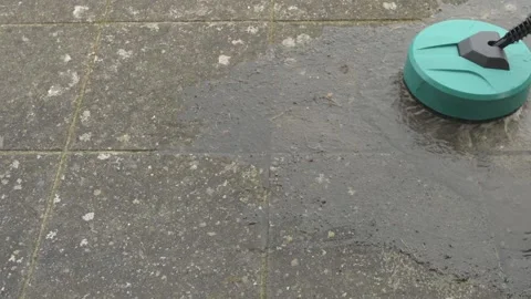 A round high-pressure washer cleaning old dirty concrete slabs Video stock 305197862