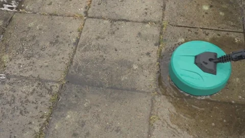 Round high-pressure washer spraying water on cement tiles Video stock 305197835