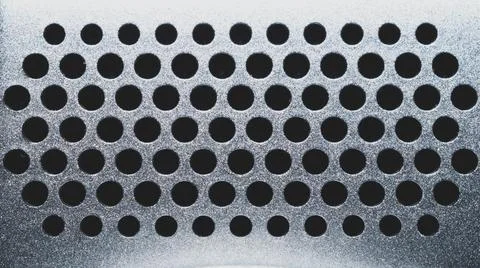 Round holes in plastic surface. grid pattern. abstract background Foto stock