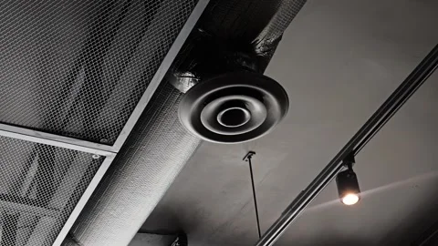 Round HVAC air diffuser on exposed ceiling ductwork system Stock-Footage 339764955