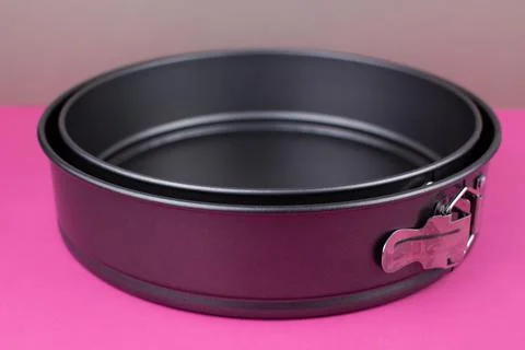 Round kitchen baking dish on background for cakes Stock Photos