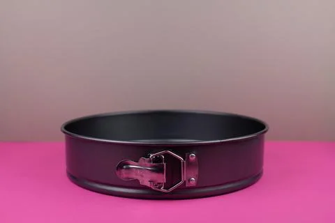 Round kitchen baking dish on background for cakes Stock Photos