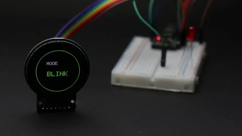 Round lcd display connected to breadboard with jumper cables Stock Footage 346665495