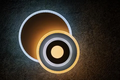 Round LED wall lights on a dark background. Stock Illustration