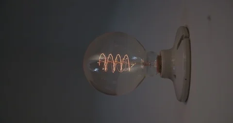 Round Light bulb turning on - 60fps Stock Footage 93753371