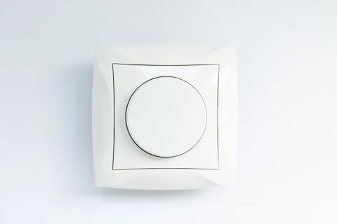 Round light switch on a white background 스톡 사진