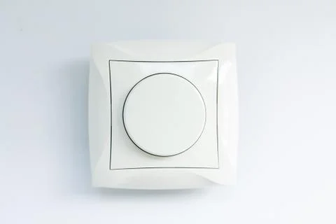 Round light switch on a white background Stock Photos