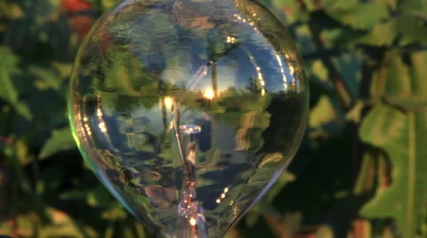 Round lightbulb in sundown setting Vídeos de archivo 48118494
