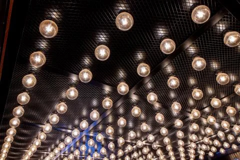 Round lights on the ceiling of the room. Stock Photos