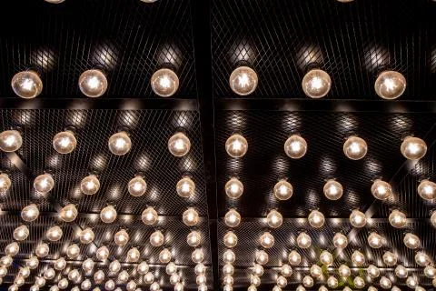 Round lights on the ceiling of the room. Stock Photos