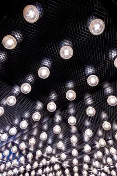 Round lights on the ceiling of the room. Stock Photos