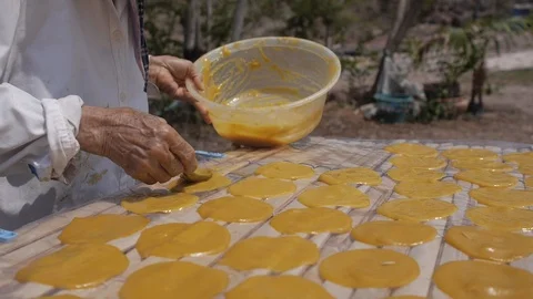 Round Mango Paste Drying on the Sun to make Dried Mango Paste Roll Stock Footage 122430651