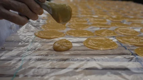 Round Mango Paste Drying on the Sun to make Dried Mango Paste Roll Stock Footage 122430910