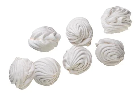 Round marshmallow flying close-up on white. Isolated Stock Photos