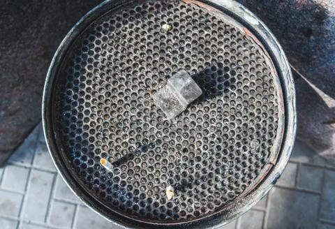 Round mesh garbage can for cigarette stubs Stock Photos