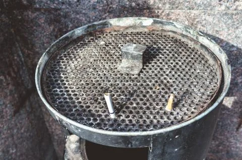 Round mesh garbage can for cigarette stubs Stock Photos
