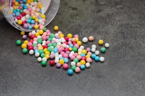Round, multi-colored candies. Candy closeup on a white background. Stock Photos