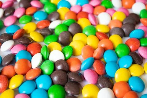 Round, multi-colored, chocolates. A pile of multicolored candies Stock Photos