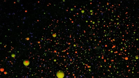 Round multicolored balls on a black background with silver sequins. Red and Stock Footage 168763112