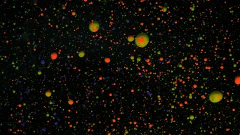 Round multicolored balls on a black background with silver sequins. Red, blue Stock Footage 170849423
