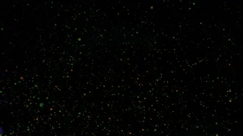 Round multicolored balls on a black background with silver sequins. Red, blue Stock Footage 170849514