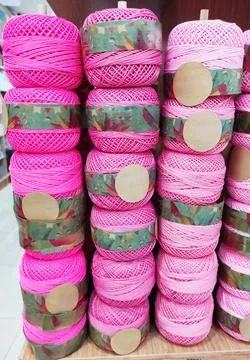 Round multicolored skeins of thread for knitting or needlework Stock Photos