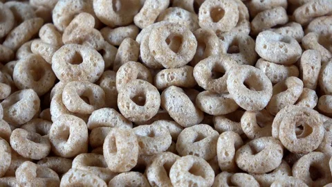 Round oat cereal pieces close up spinning video Stock Footage 103056050