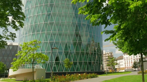 Round office building with trees in the foreground Stock Footage 38334973